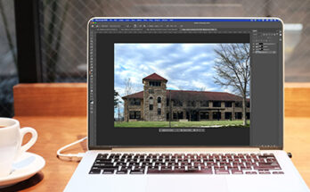Image of laptop with Photoshop open and Adjustment brush being used