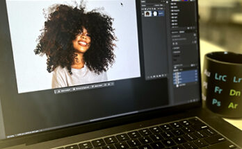 Image of laptop in classroom with Photoshop open and cut out photo shown.
