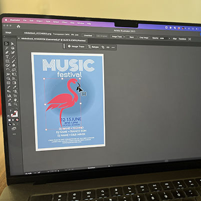 Image of laptop with Illustrator open featuring contextual task bar