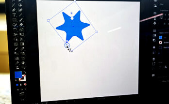 Image of laptop with Illustrator open and live star tool being used.