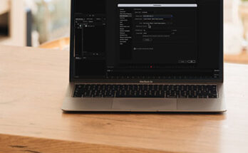 Image of laptop on table with Audition Preferences open